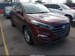 KM8J3CA2XGU039061 2016 HYUNDAI TUCSON
